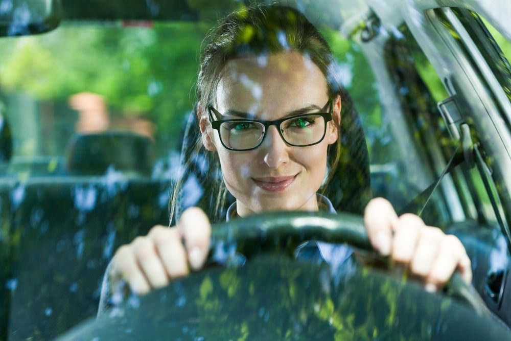 Young attractive woman in glasses driving a car 1.jpegkeepProtocol EarnFreeCashOnline